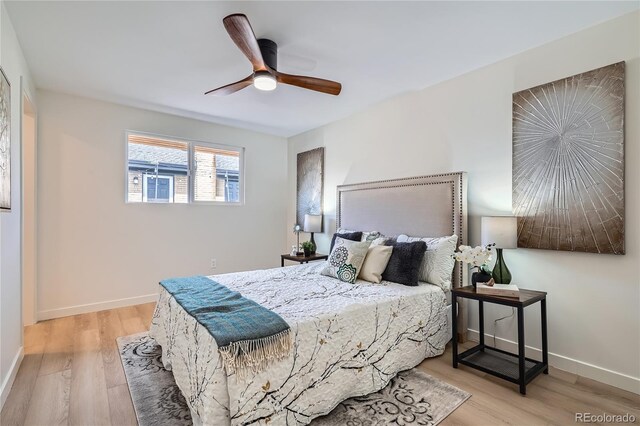 2065 Depew St, Edgewater, CO 80214 - bedroom featuring wood finished floors, baseboards, and a ceiling fan