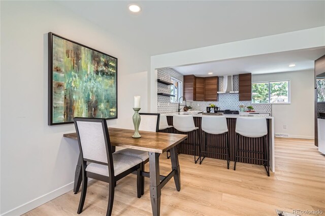 2065 Depew St, Edgewater, CO 80214 - dining area with light wood finished floors, recessed lighting, and baseboards