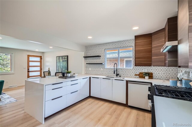 2065 Depew St, Edgewater, CO 80214 - kitchen featuring a sink, modern cabinets, light countertops, gas range, and recessed lighting