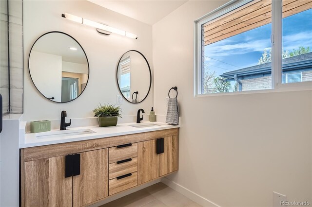 2065 Depew St, Edgewater, CO 80214 - bathroom with double vanity, baseboards, and tile patterned floors