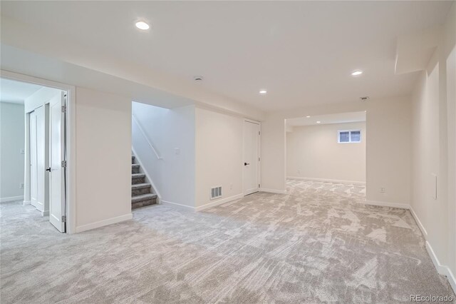 2065 Depew St, Edgewater, CO 80214 - finished basement with light colored carpet, stairway, baseboards, and recessed lighting