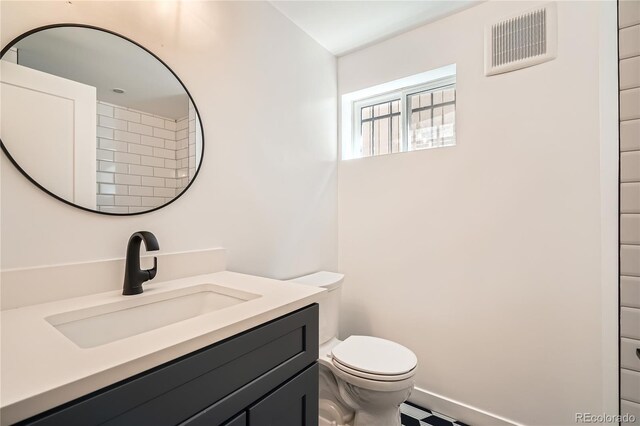 2065 Depew St, Edgewater, CO 80214 - bathroom featuring toilet and vanity