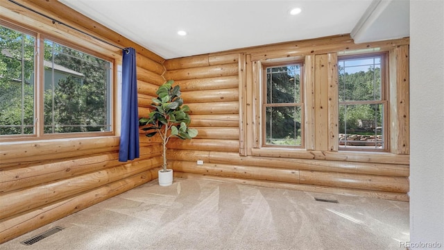 empty room with recessed lighting, visible vents, and carpet