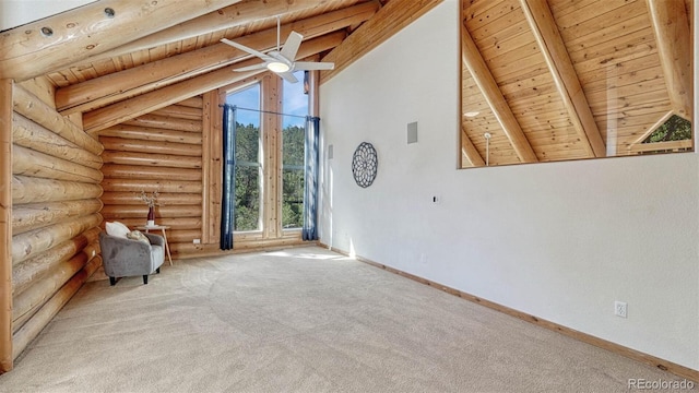 interior space featuring beam ceiling, wooden ceiling, carpet flooring, log walls, and baseboards