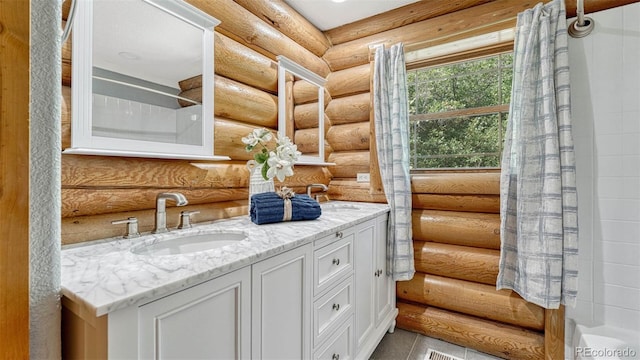 full bath featuring vanity, a shower with curtain, and tile patterned flooring