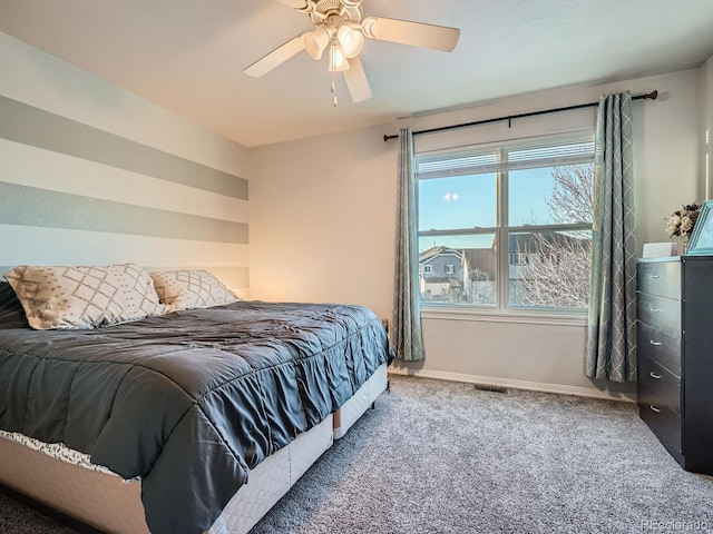 bedroom with ceiling fan and carpet flooring