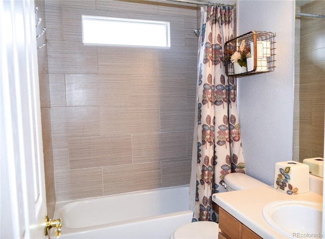 full bathroom featuring shower / tub combo with curtain, toilet, and vanity