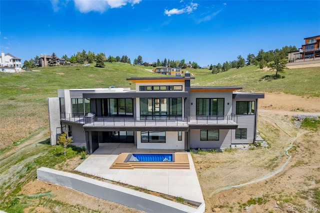 545 Strada Rossa Rd, Golden, CO 80401 - back of house featuring a patio area, a balcony, and an outdoor pool