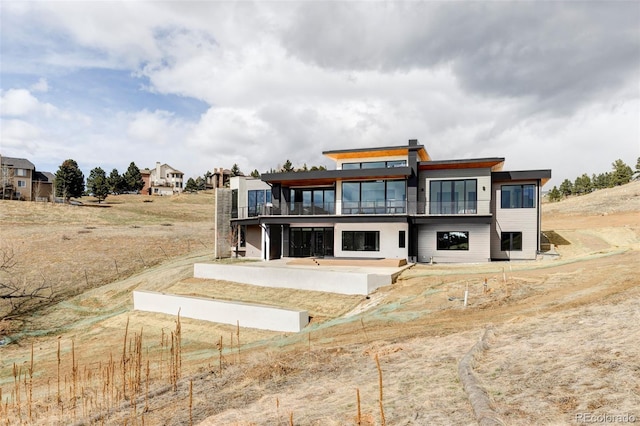 545 Strada Rossa Rd, Golden, CO 80401 - back of property with a balcony and a patio