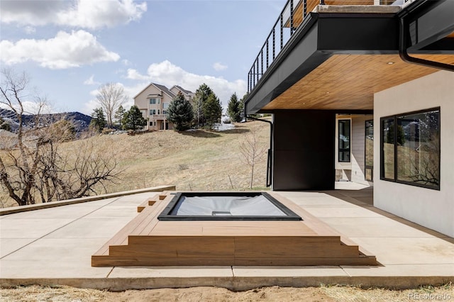 545 Strada Rossa Rd, Golden, CO 80401 - view of patio / terrace with a jacuzzi and a wooden deck