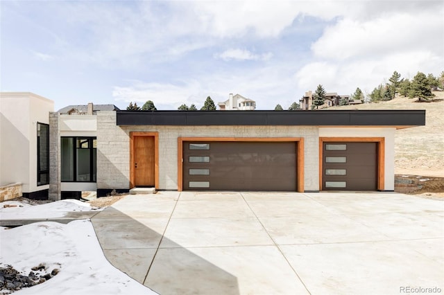 545 Strada Rossa Rd, Golden, CO 80401 - modern home featuring an attached garage and concrete driveway