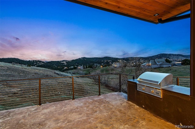 545 Strada Rossa Rd, Golden, CO 80401 - view of patio featuring area for grilling and a mountain view