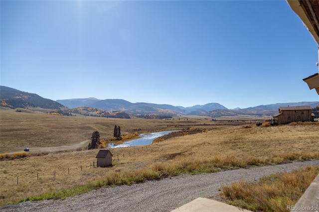 property view of mountains featuring a rural view