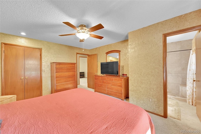 12348 Elizabeth Ct, Thornton, CO 80241 - bedroom with carpet, ceiling fan, a textured ceiling, a textured wall, and ensuite bath