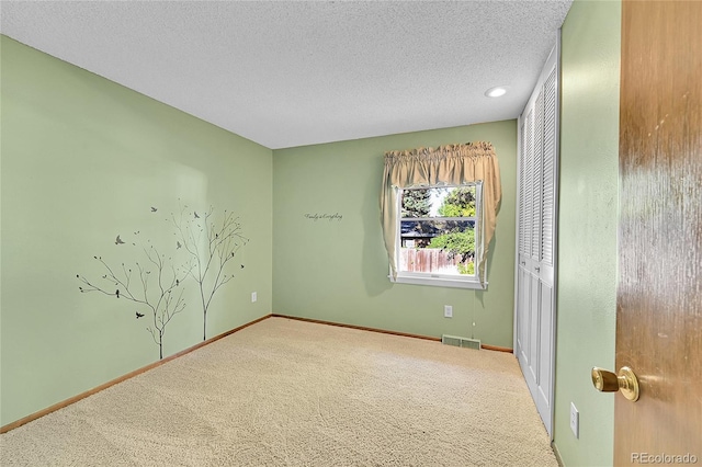 12348 Elizabeth Ct, Thornton, CO 80241 - unfurnished room featuring carpet floors, a textured ceiling, baseboards, and recessed lighting