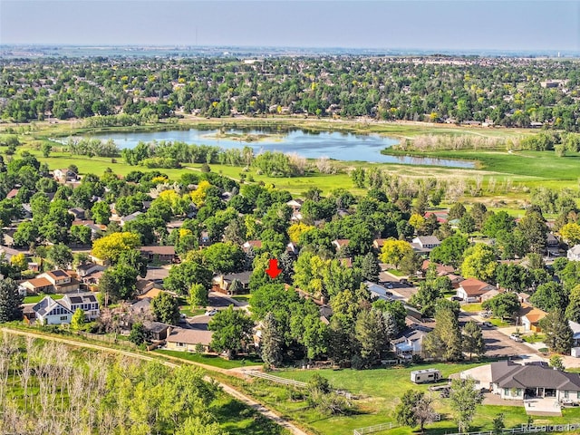 12348 Elizabeth Ct, Thornton, CO 80241 - aerial view of residential area featuring a nearby body of water and a tree filled landscape
