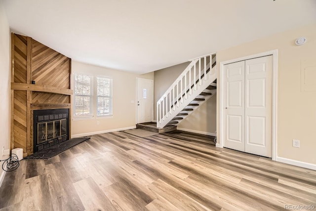 unfurnished living room featuring hardwood / wood-style floors