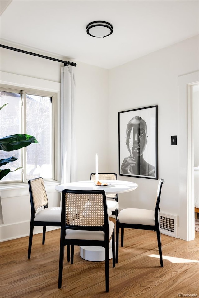 dining area featuring hardwood / wood-style floors