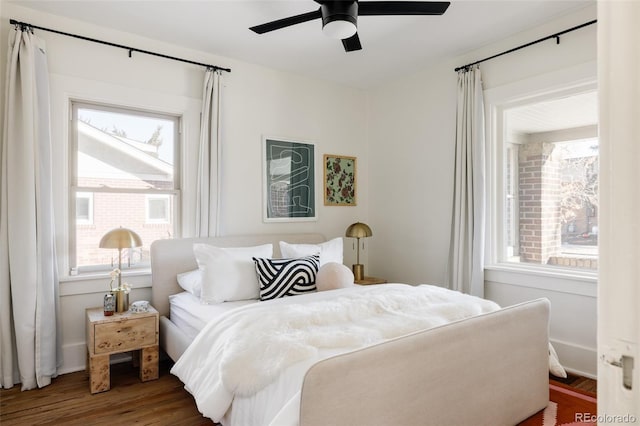 bedroom featuring ceiling fan and hardwood / wood-style flooring