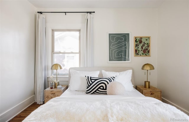 bedroom with wood-type flooring