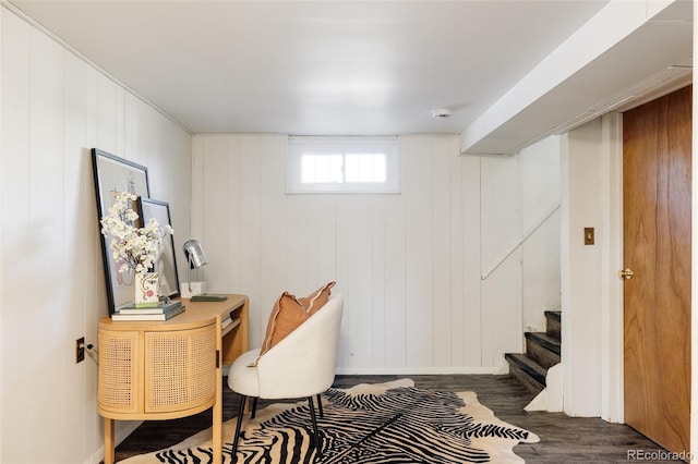 office space featuring dark hardwood / wood-style floors and wood walls