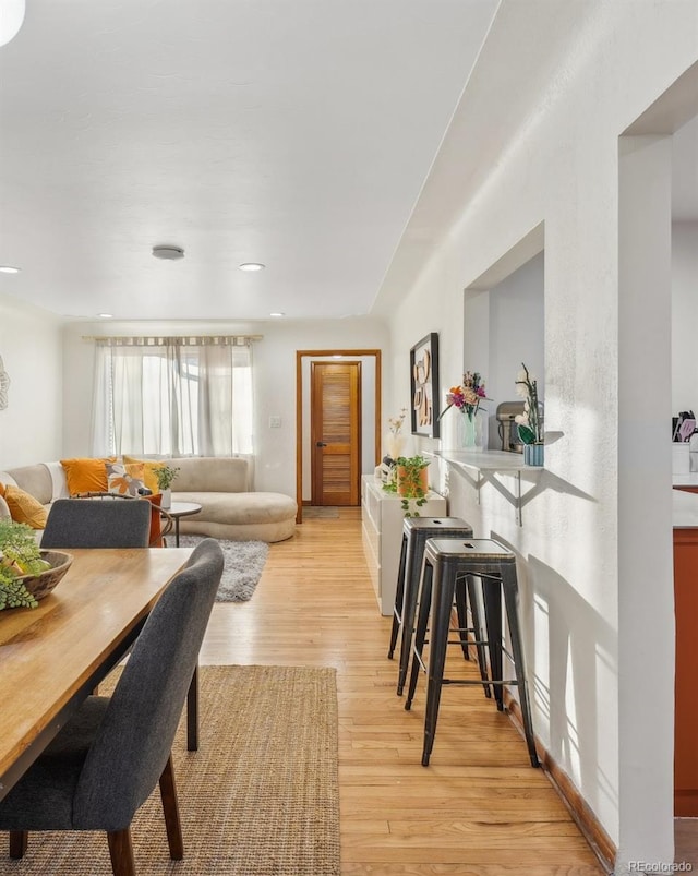 living room with light hardwood / wood-style floors