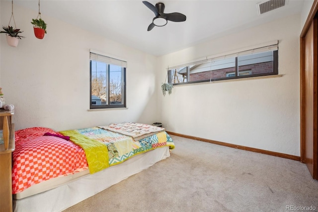 carpeted bedroom featuring ceiling fan