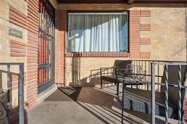 2042 Jamaica St, Aurora, CO 80010 - doorway to property featuring brick siding