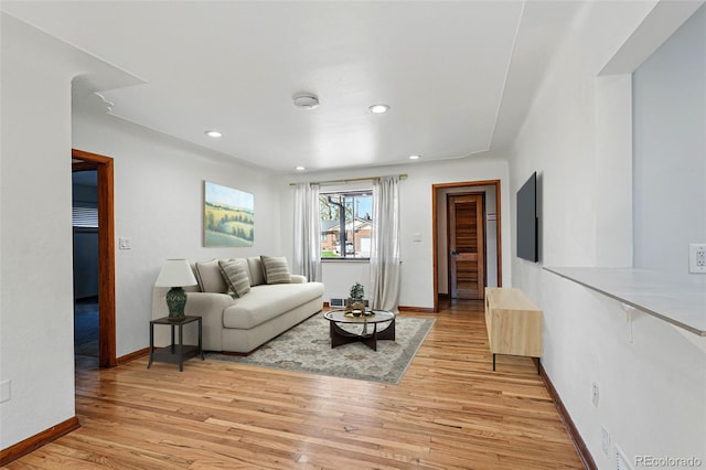 2042 Jamaica St, Aurora, CO 80010 - living area with light wood-style floors, baseboards, and recessed lighting