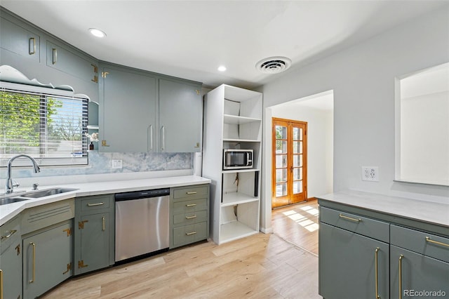 2042 Jamaica St, Aurora, CO 80010 - kitchen with stainless steel appliances, a sink, healthy amount of natural light, light wood-type flooring, and recessed lighting