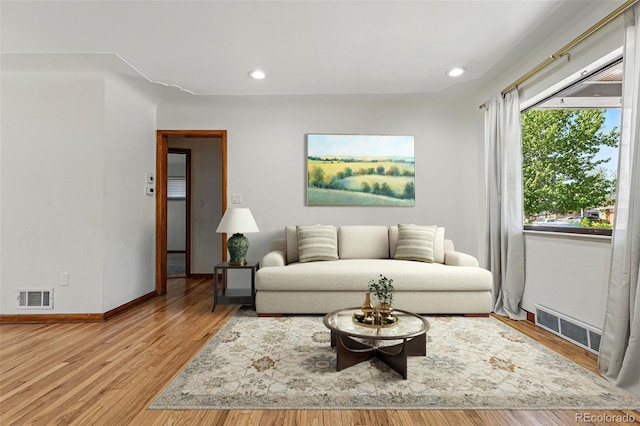 2042 Jamaica St, Aurora, CO 80010 - living room featuring wood finished floors, baseboards, and recessed lighting