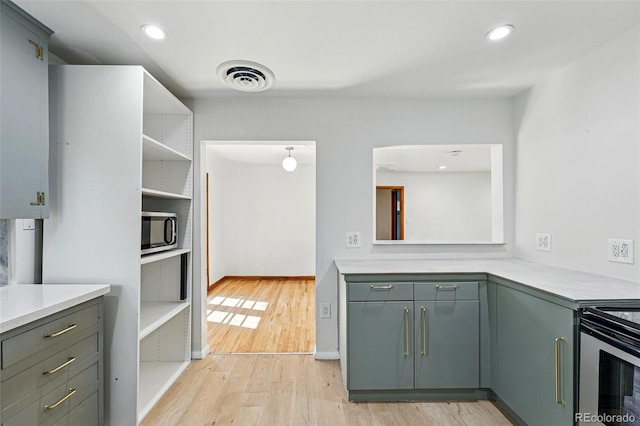 2042 Jamaica St, Aurora, CO 80010 - kitchen featuring stainless steel appliances, light wood-style floors, light countertops, recessed lighting, and open shelves