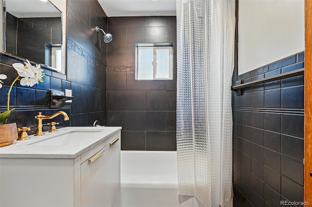 2042 Jamaica St, Aurora, CO 80010 - bathroom with tile walls, shower / bath combo with shower curtain, and vanity