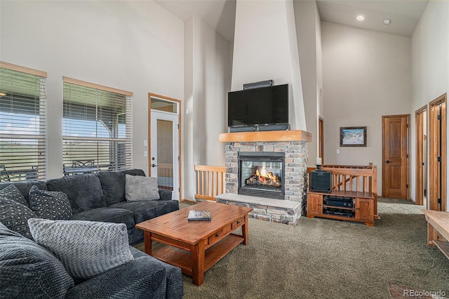109 Peak Vw, Granby, CO 80446 - living area with high vaulted ceiling, carpet flooring, and a fireplace