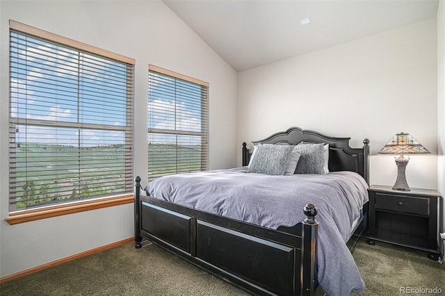 109 Peak Vw, Granby, CO 80446 - bedroom with dark carpet, vaulted ceiling, and baseboards