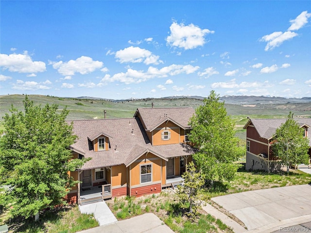 109 Peak Vw, Granby, CO 80446 - view of front of home with covered porch, roof with shingles, and a mountain view