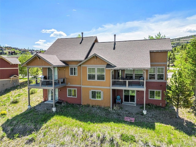 109 Peak Vw, Granby, CO 80446 - back of property featuring a balcony and roof with shingles