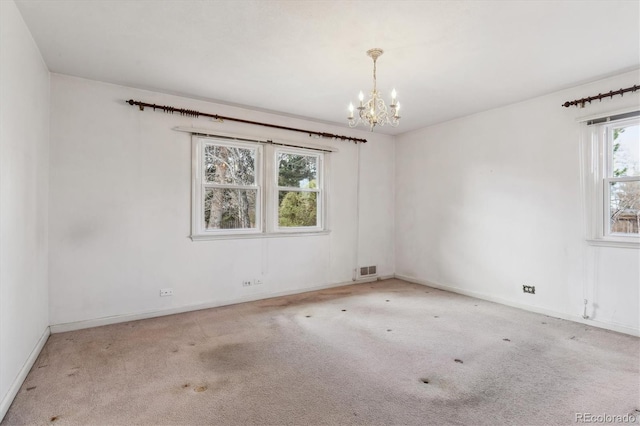 3201 S Albion St, Denver, CO 80222 - carpeted empty room featuring a chandelier and baseboards