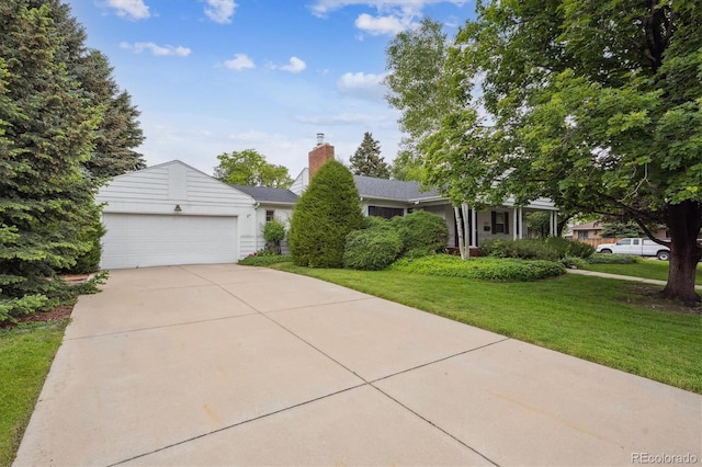 3201 S Albion St, Denver, CO 80222 - view of front of house with a front yard, driveway, an attached garage, and a chimney