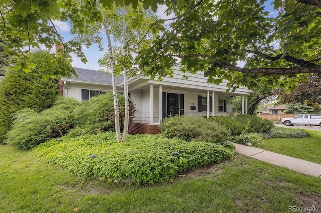 3201 S Albion St, Denver, CO 80222 - view of front of house with a front yard, brick siding, and a porch