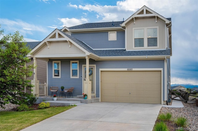 6880 Backcountry Loop, Colorado Springs, CO 80927 - craftsman inspired home featuring covered porch, driveway, a shingled roof, an attached garage, and board and batten siding