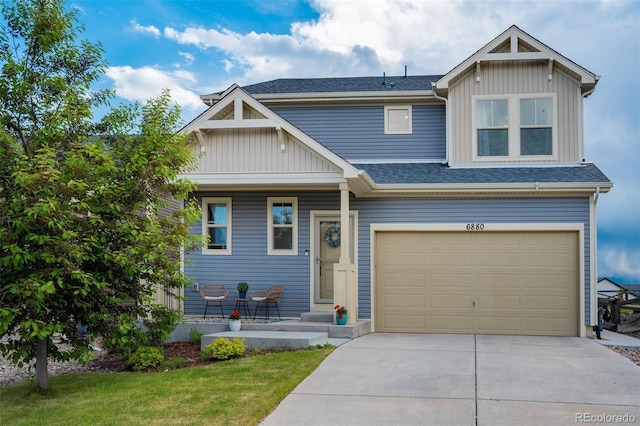 6880 Backcountry Loop, Colorado Springs, CO 80927 - view of front of property with concrete driveway, a porch, an attached garage, board and batten siding, and a shingled roof