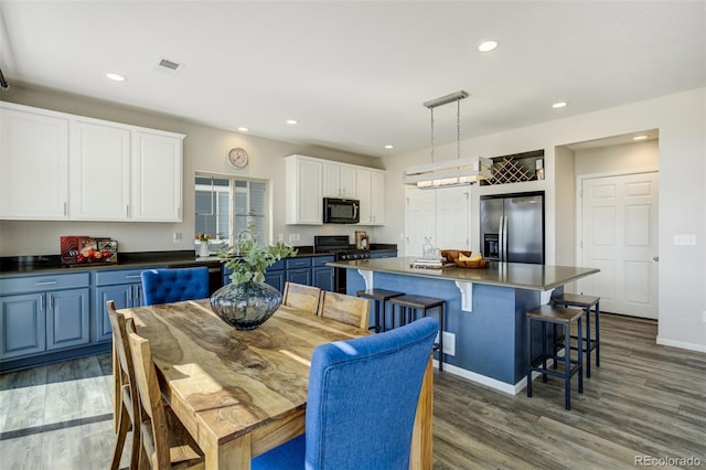 6880 Backcountry Loop, Colorado Springs, CO 80927 - dining area featuring wood finished floors, recessed lighting, and baseboards
