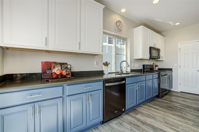 6880 Backcountry Loop, Colorado Springs, CO 80927 - kitchen with black appliances, blue cabinetry, a sink, dark countertops, and recessed lighting