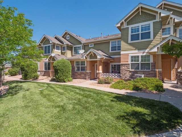 3662 S Perth Cir Unit 104, Aurora, CO 80013 - craftsman-style home featuring stone siding and a front lawn