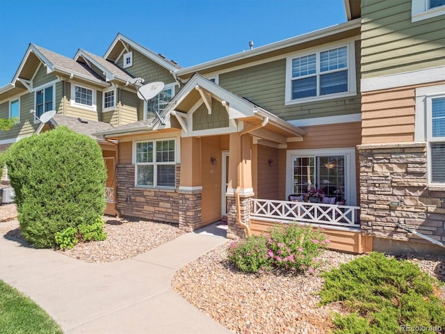 3662 S Perth Cir Unit 104, Aurora, CO 80013 - view of front facade featuring stone siding and covered porch
