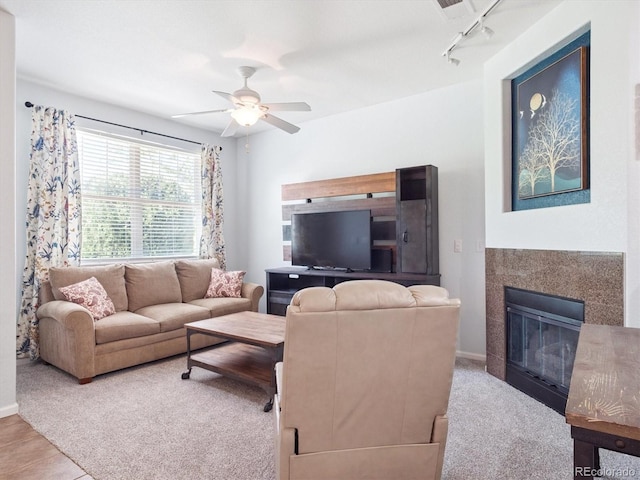 3662 S Perth Cir Unit 104, Aurora, CO 80013 - living room with ceiling fan and a tile fireplace