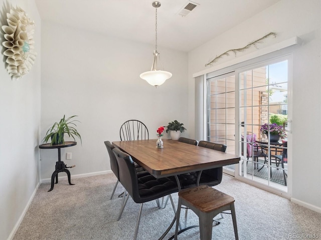 3662 S Perth Cir Unit 104, Aurora, CO 80013 - dining room featuring light colored carpet and baseboards