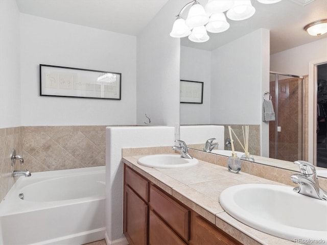 3662 S Perth Cir Unit 104, Aurora, CO 80013 - full bath with a garden tub, a chandelier, double vanity, and a shower stall