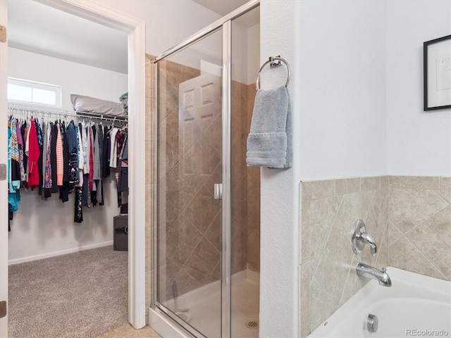 3662 S Perth Cir Unit 104, Aurora, CO 80013 - bathroom with a garden tub, a shower stall, and a walk in closet
